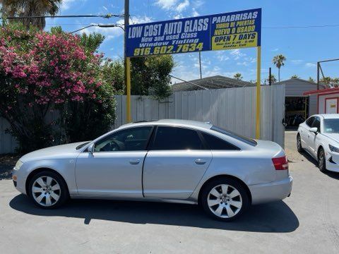 White Car Sideview — Sacramento, CA — Low Cost Auto Glass & Window Tinting