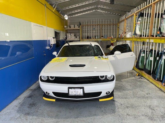 Tinted White Car on A Shop — Sacramento, CA — Low Cost Auto Glass & Window Tinting
