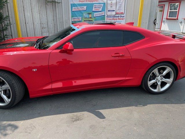 Red Car with Dark Tint — Sacramento, CA — Low Cost Auto Glass & Window Tinting