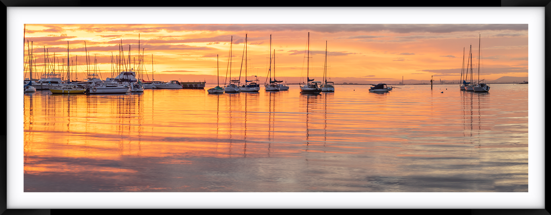 a picture of a harbor with boats in it