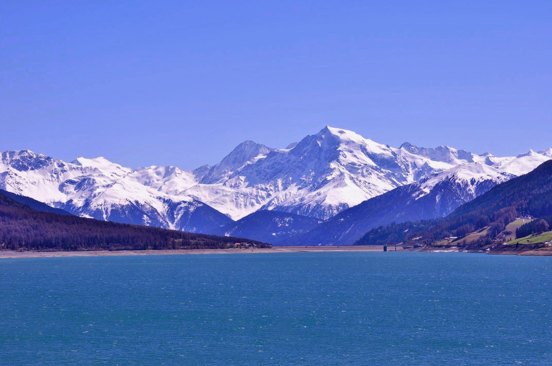 Lake Reschensee and Ortler Alps in the background