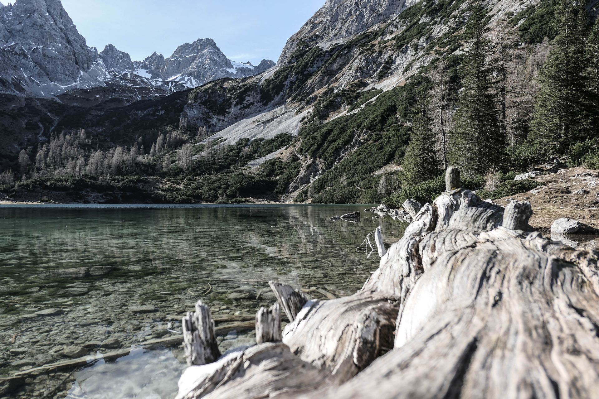 Peaceful alpine lake surrounded by dramatic mountain scenery in the Alps