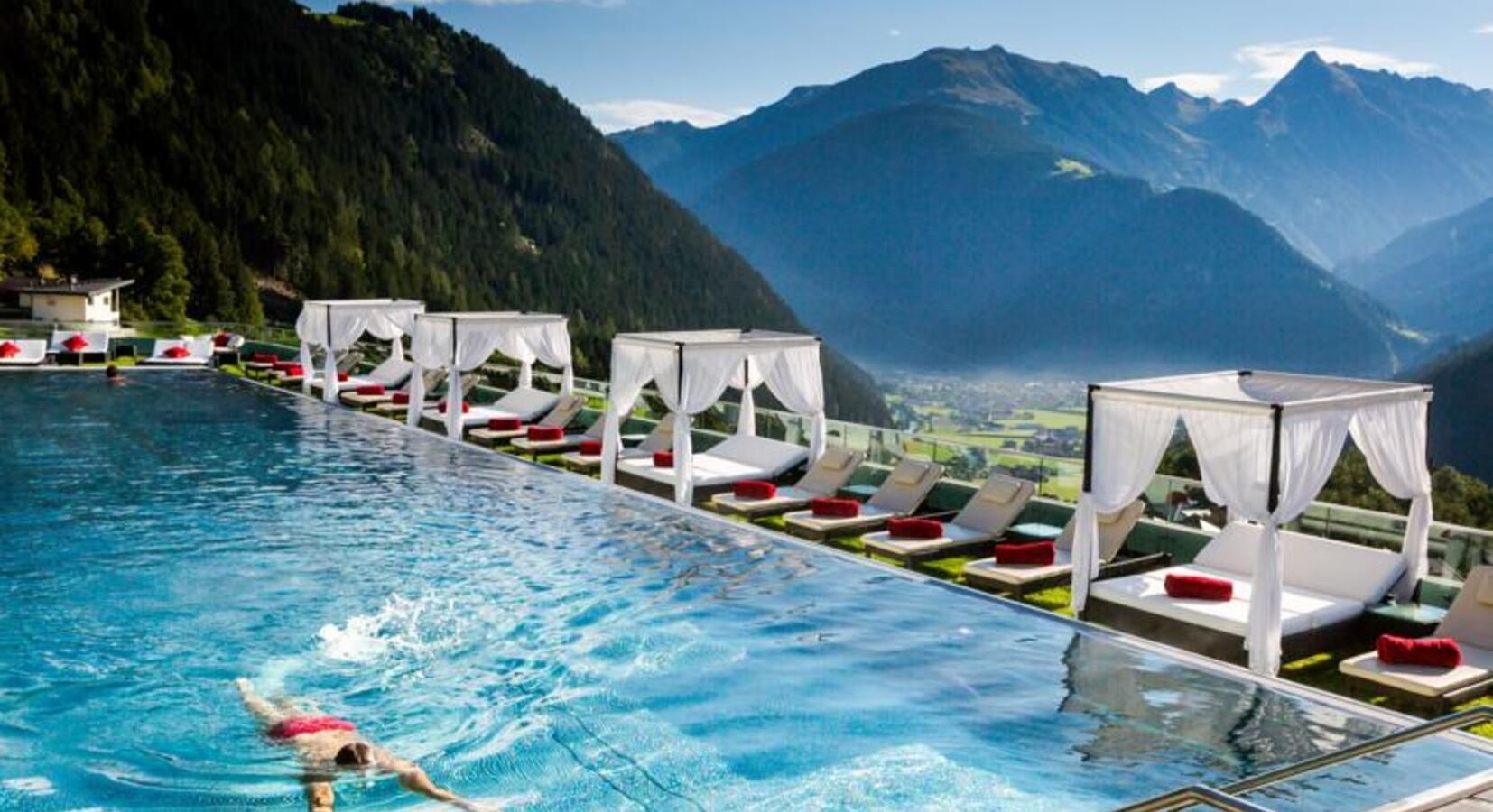 Luxury infinity pool retreat with panoramic mountain views in the Austrian Alps