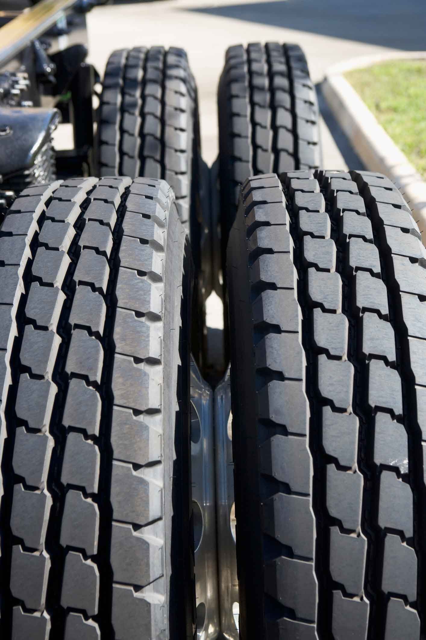 A close up of four tires on a truck