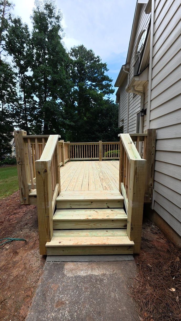 Wood stairs leading onto a rebuilt Jonesboro deck