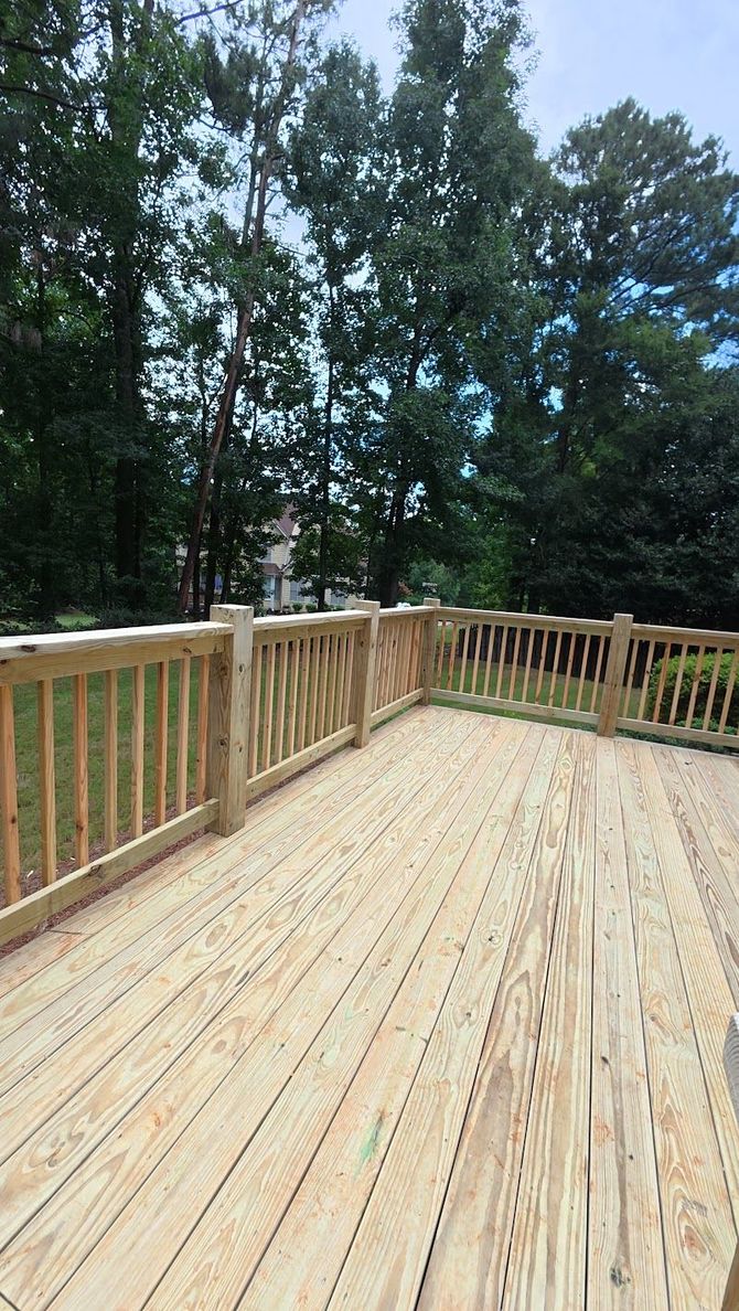 Rebuilt wood deck with wood railing in Jonesboro, Georgia