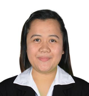 A woman wearing a black jacket and white shirt smiles for the camera