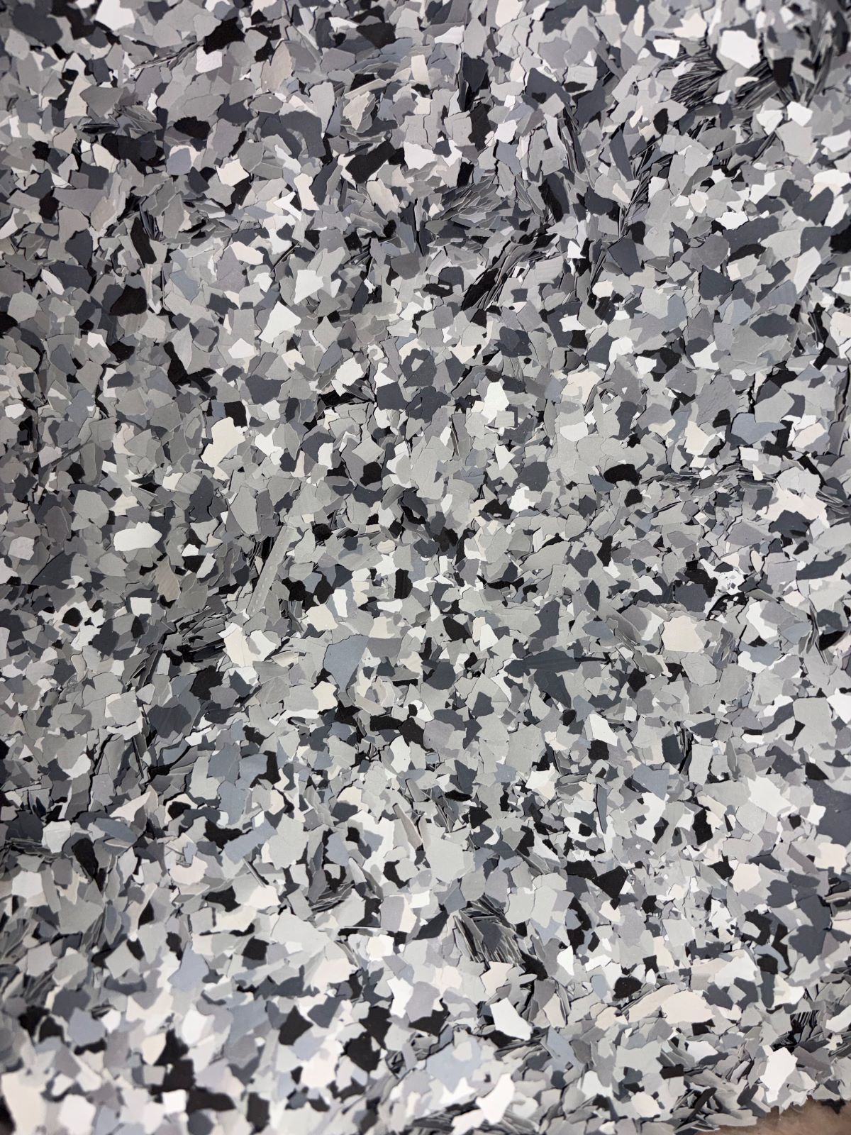 Gray and white speckled stone or gravel texture filling the frame