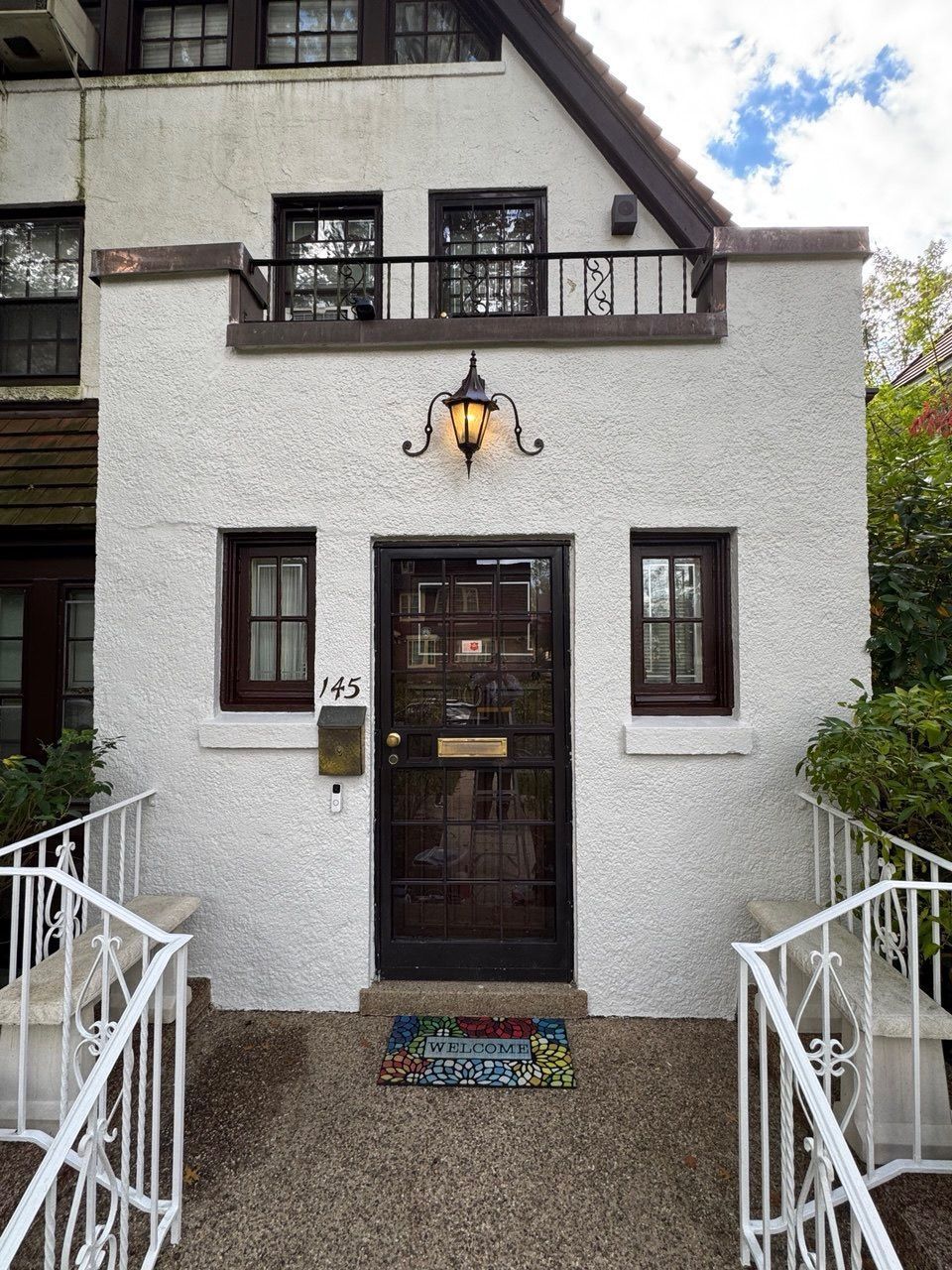 Residential exterior house painting with freshly renovated facade in NYC