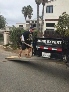 Man loads wooden plank into