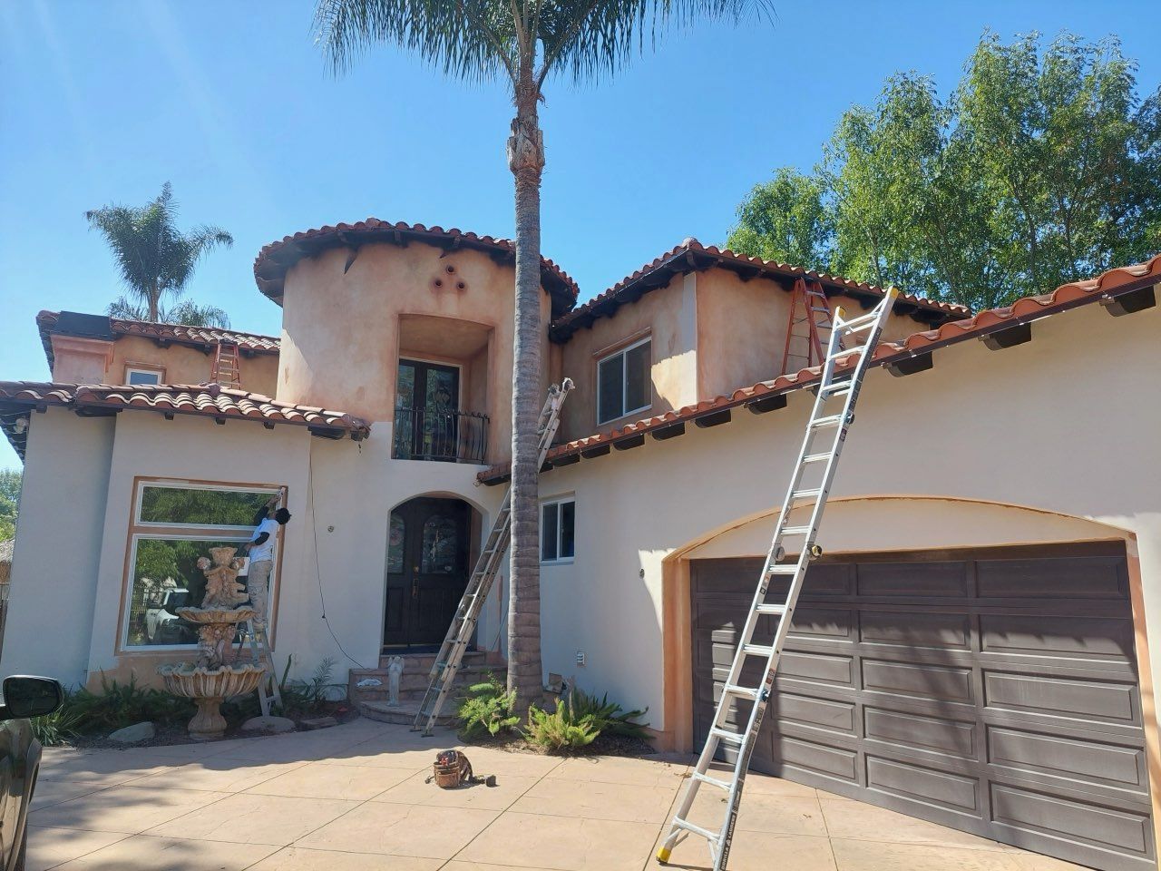 stucco home tile roof gutters