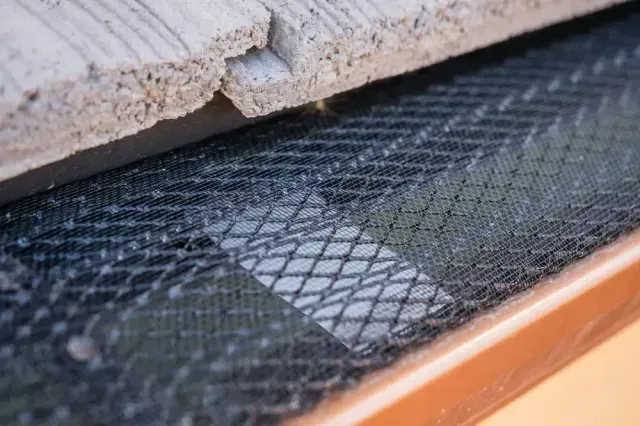 spanish tile roof gutter screen close up