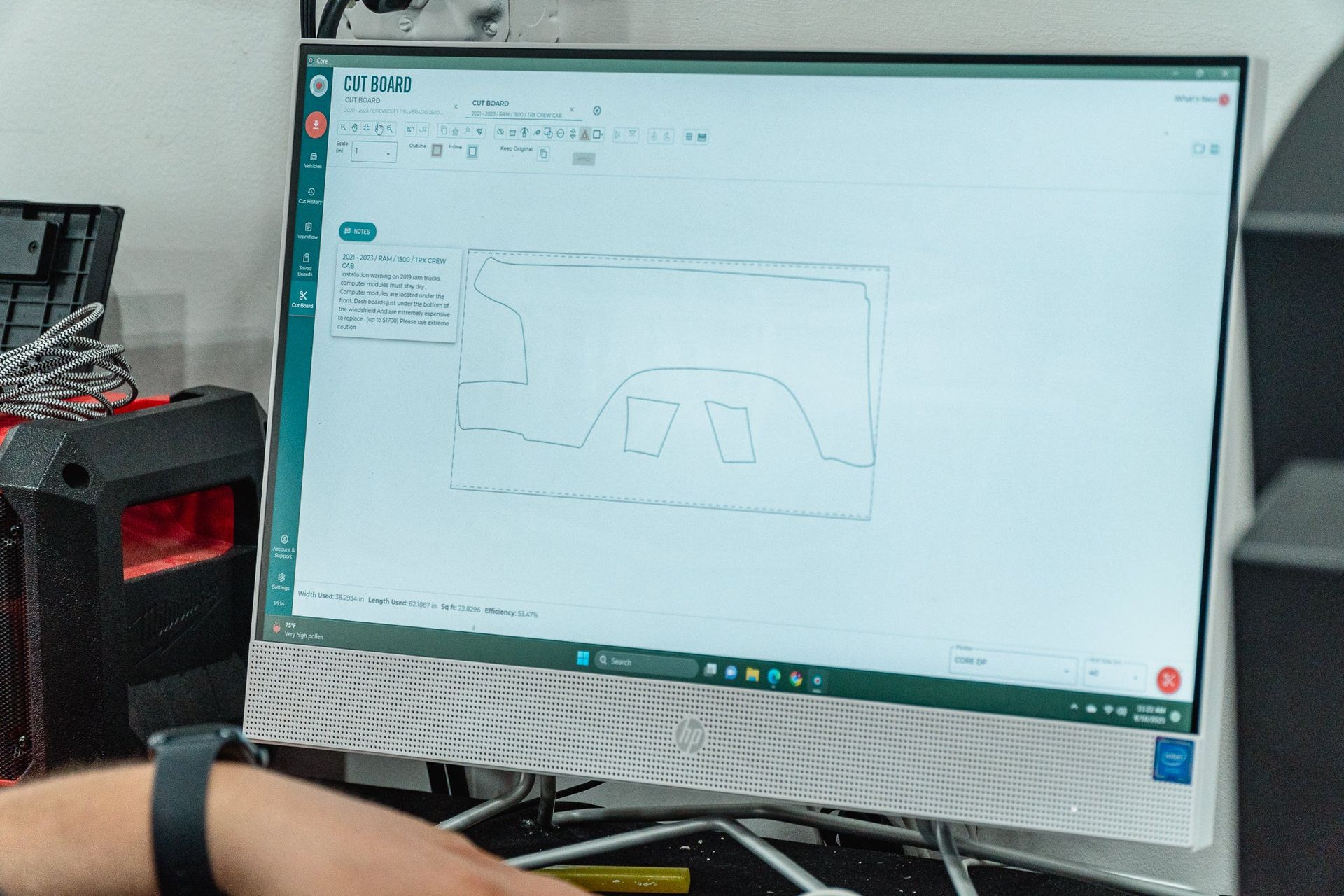 Computer monitor displaying a technical diagram on a white screen in an office setting