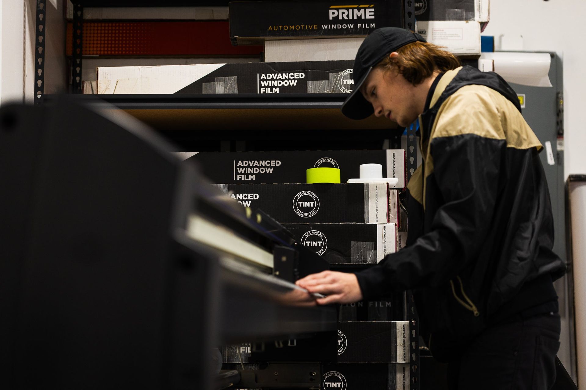 Technician in headset working at a server rack in a data center