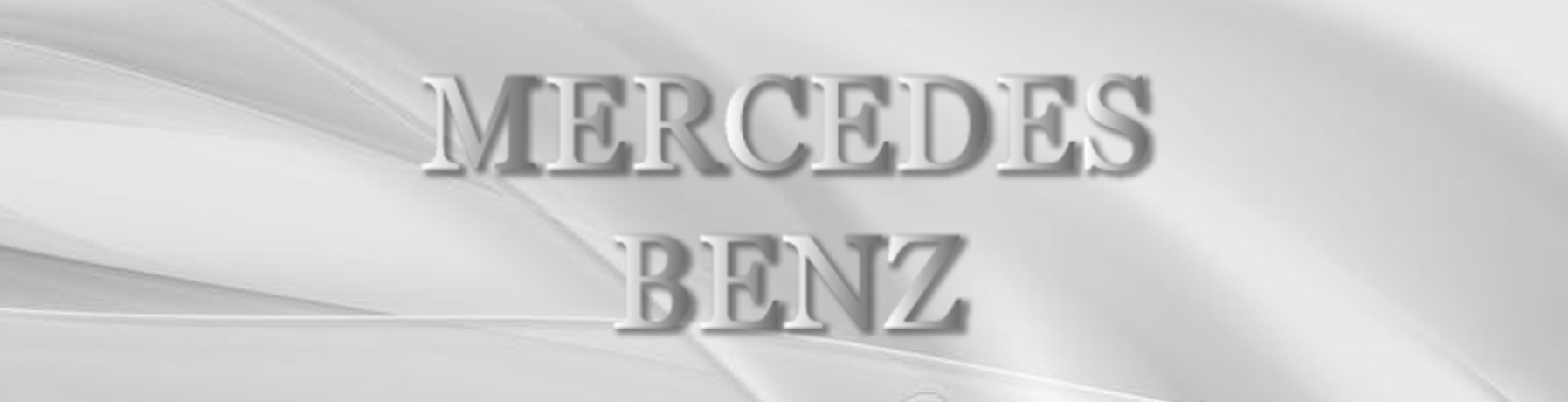 Mercedes-Benz logo in metallic silver text on a light gray background
