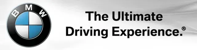 BMW logo with slogan “The Ultimate Driving Experience” on a white background