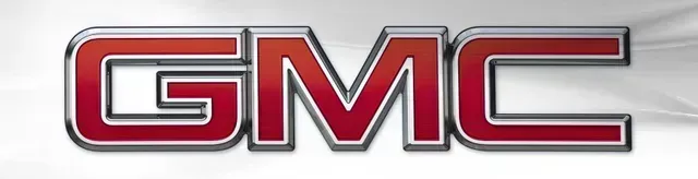 Red GMC logo with chrome and black outline on a white background