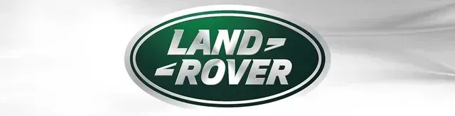Land Rover logo in white on a green oval with silver outline