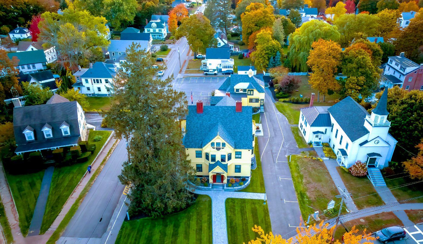 An aerial view of a residential area with lots of houses and trees