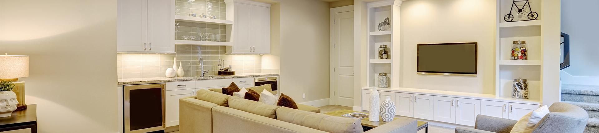 A living room filled with furniture and a television.