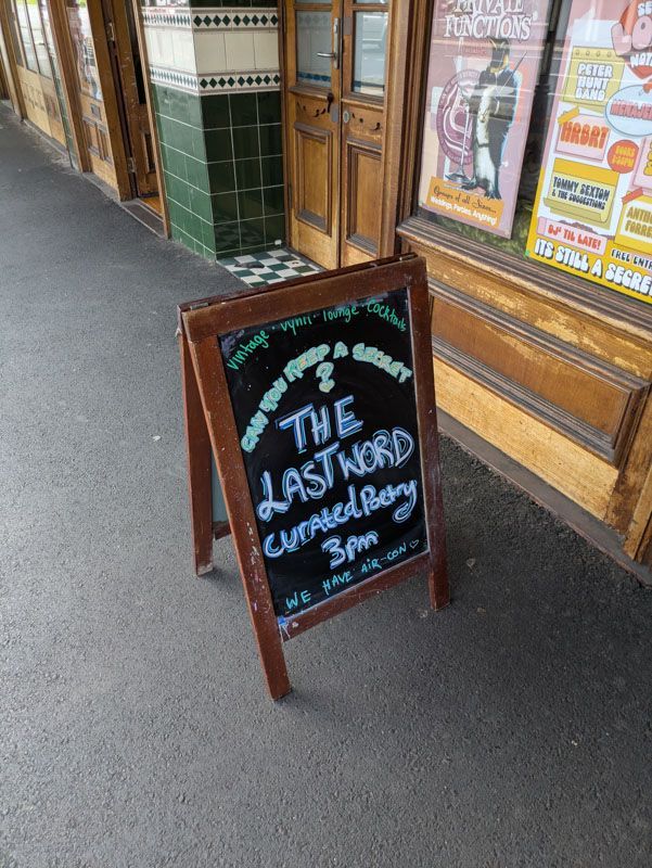 The Last Word chalkboard sign