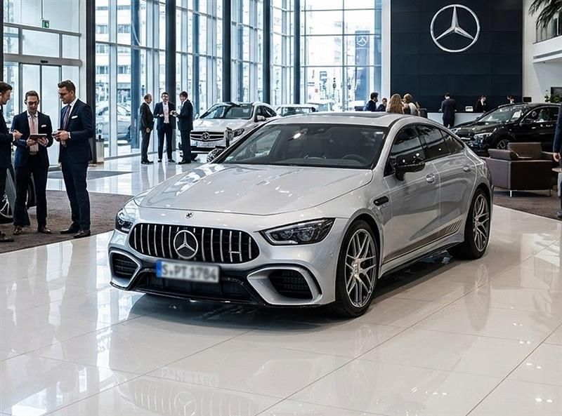 People in business attire reviewing documents, discussing, in an office setting.