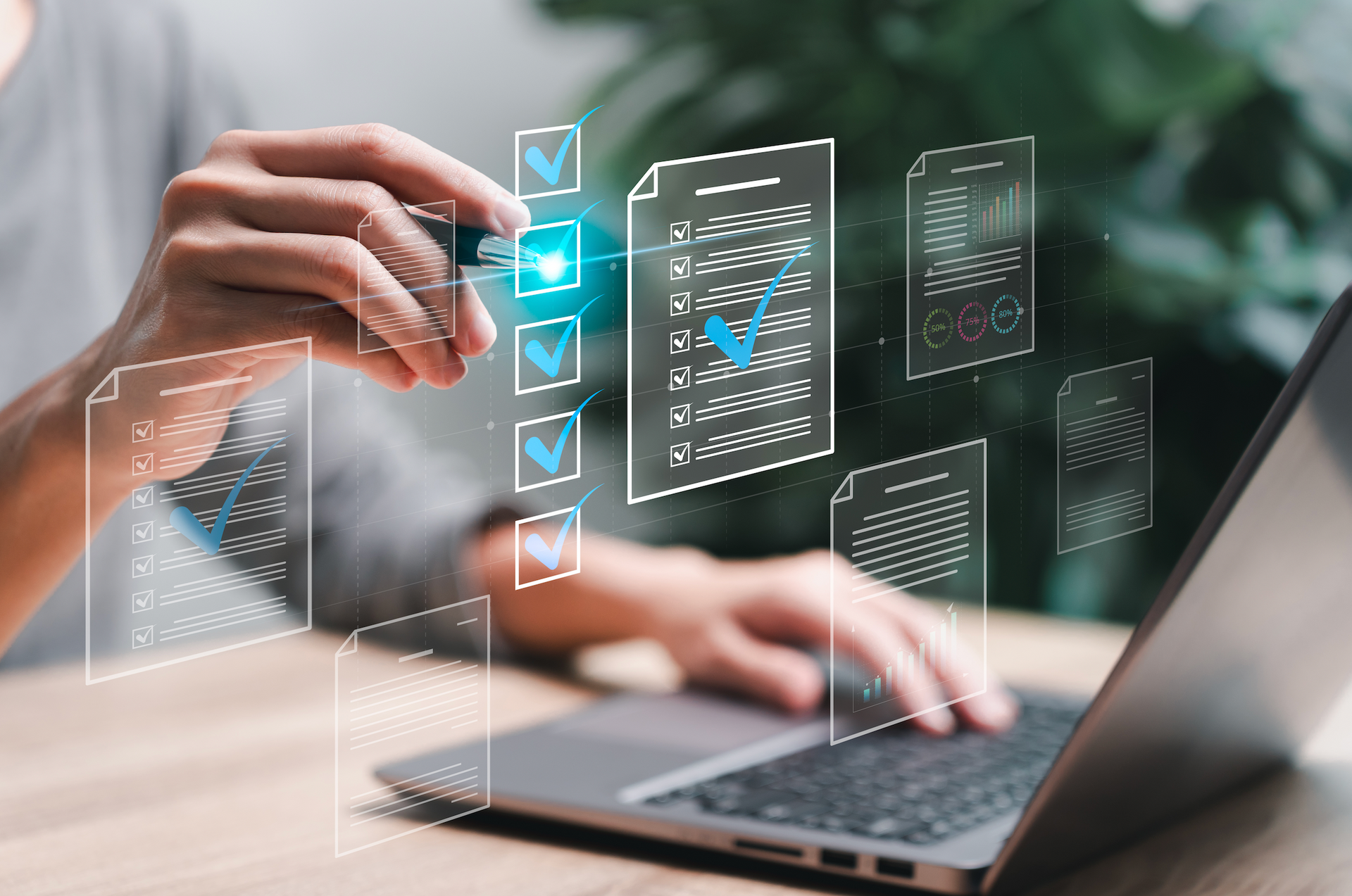Person using laptop, digitally checking a document with checkboxes.