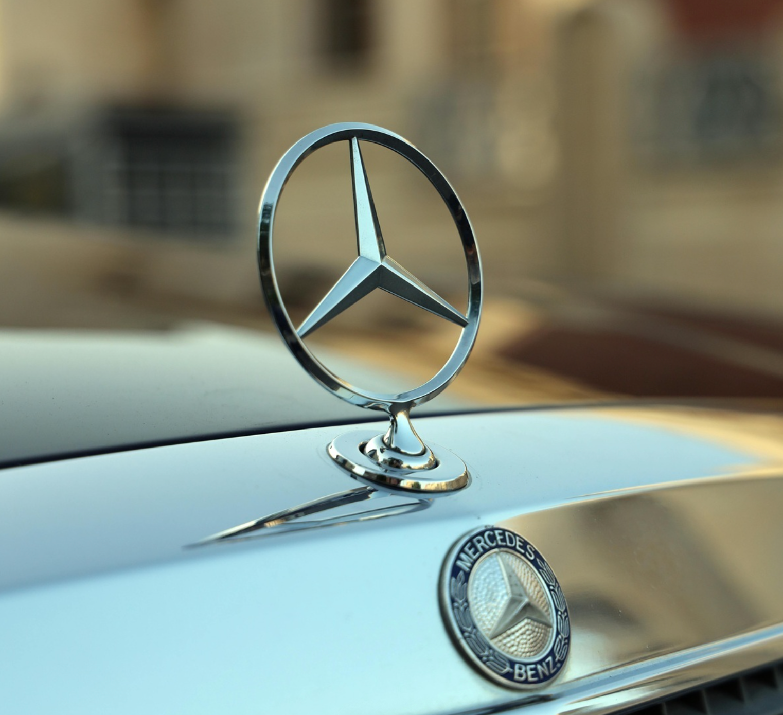 People in business attire reviewing documents, discussing, in an office setting.