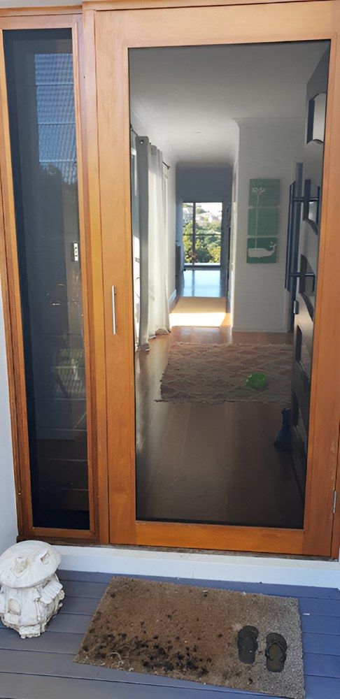 A Wooden Door With a Screen on It — North Coast Screens & Repairs in East Ballina, NSW