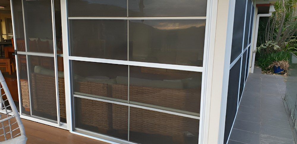 A Screened in Porch With Sliding Glass Doors — North Coast Screens & Repairs in Ballina, NSW