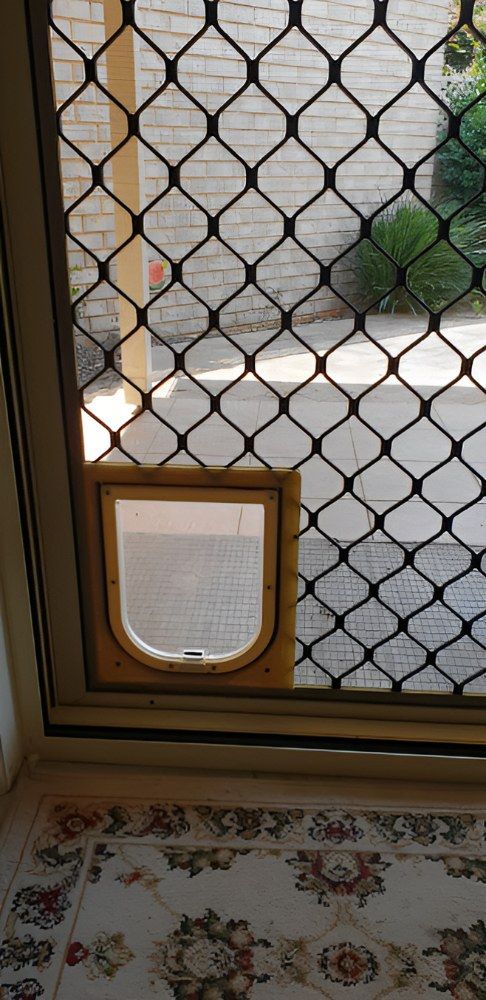 A Screen Door with a Cat Door — North Coast Screens & Repairs in Lennox Head, NSW