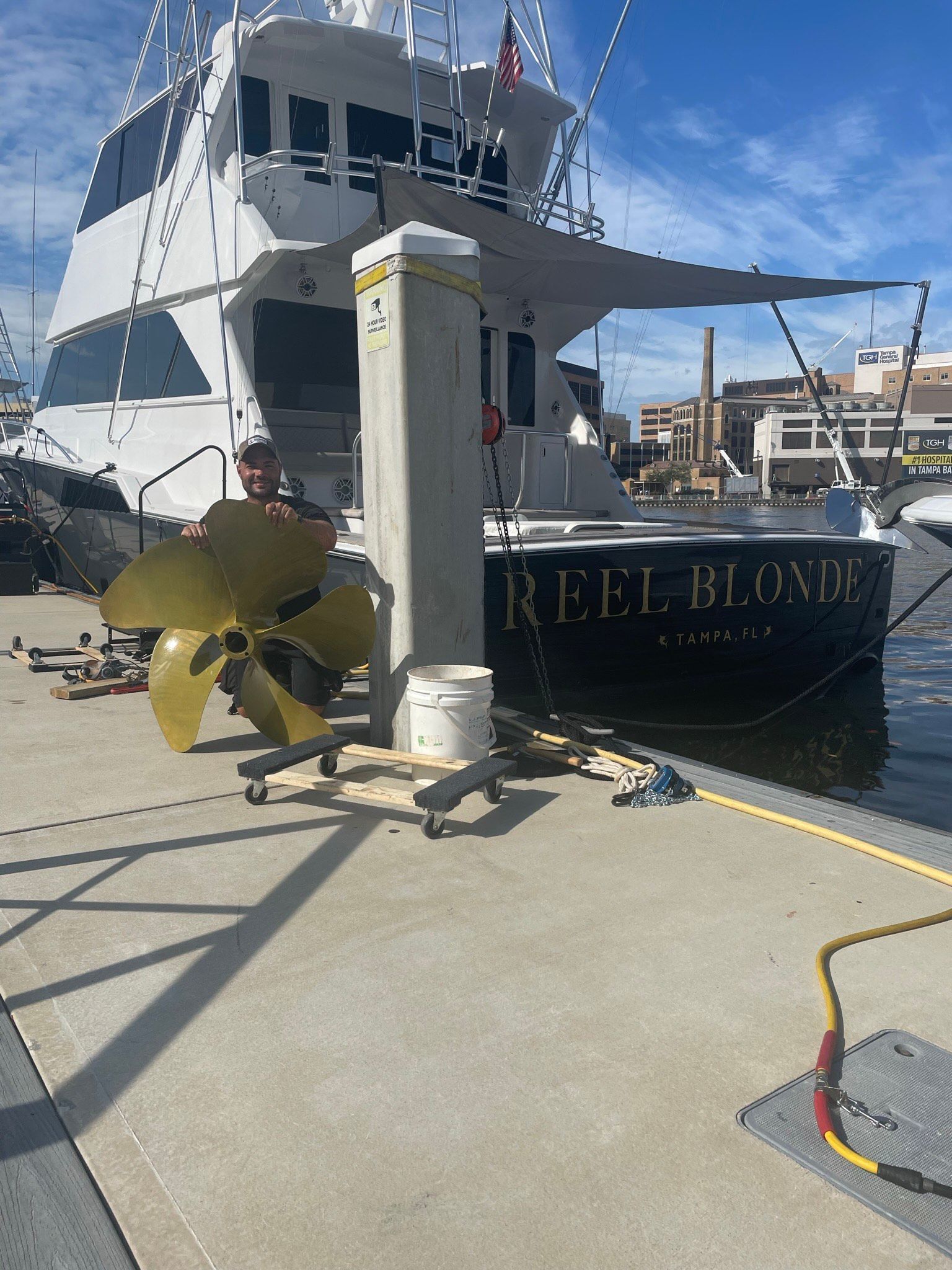 A Boat is Docked at a Dock with a Large Propeller in Front of It — Palm Harbor, FL — Ozona Dive Service