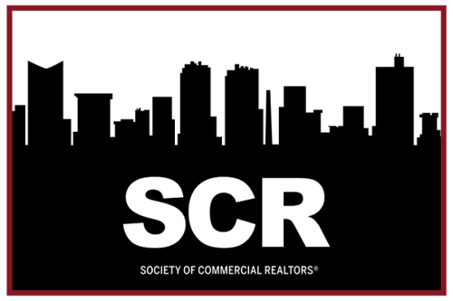 The logo for the society of commercial realtors shows a city skyline.