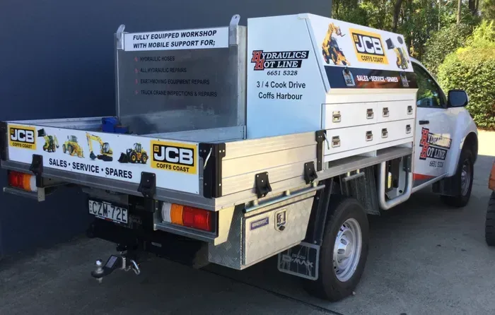 Worker Checking a High Pressure Hydraulic Hose — Hydraulic Repair Service Coffs Harbour, NSW