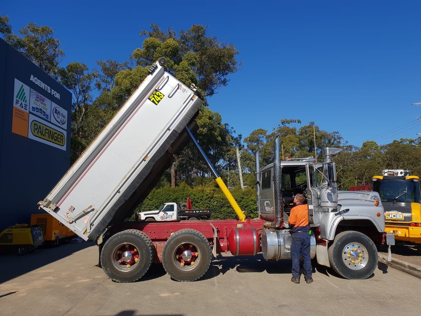 Hydraulic Pipes on a Yellow Tractor — Hydraulic Repair Service Coffs Harbour, NSW