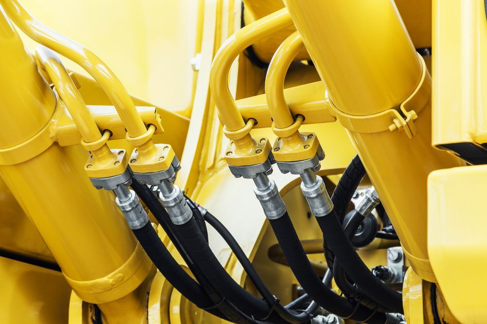 Hydraulic Hoses on a Yellow Tractor — Hydraulic Repair Service Coffs Harbour, NSW