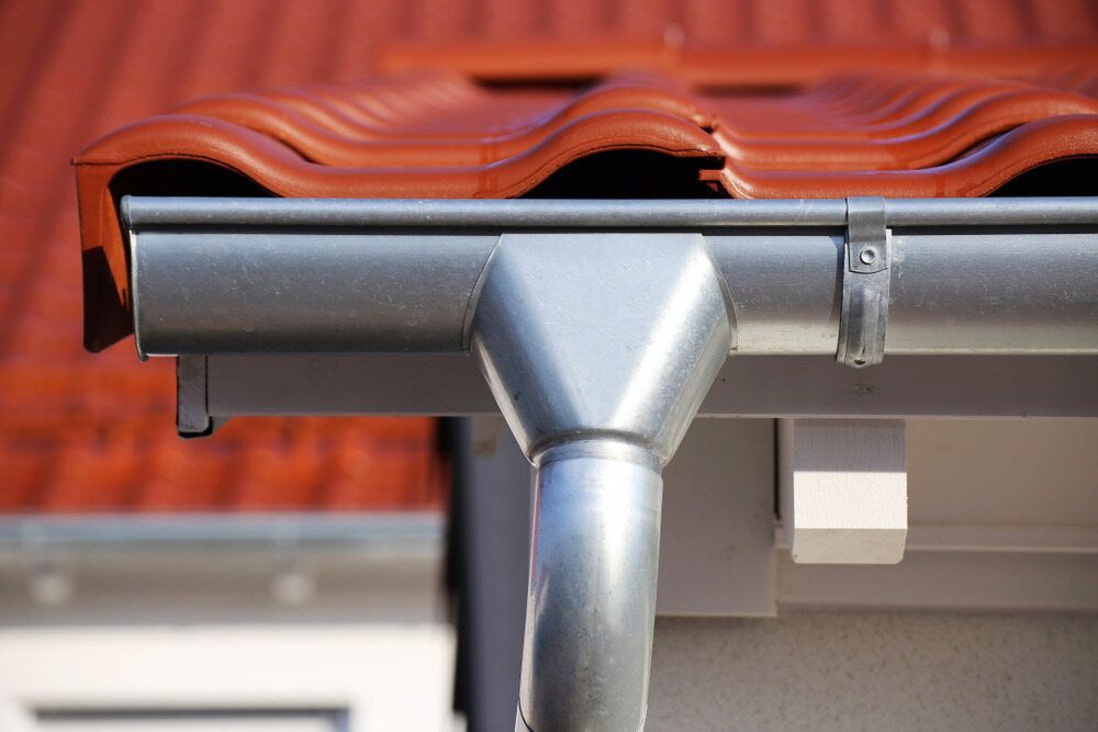A Close Up Of A Gutter On A Roof Of A House — Panorama Plumbing In Dubbo, NSW