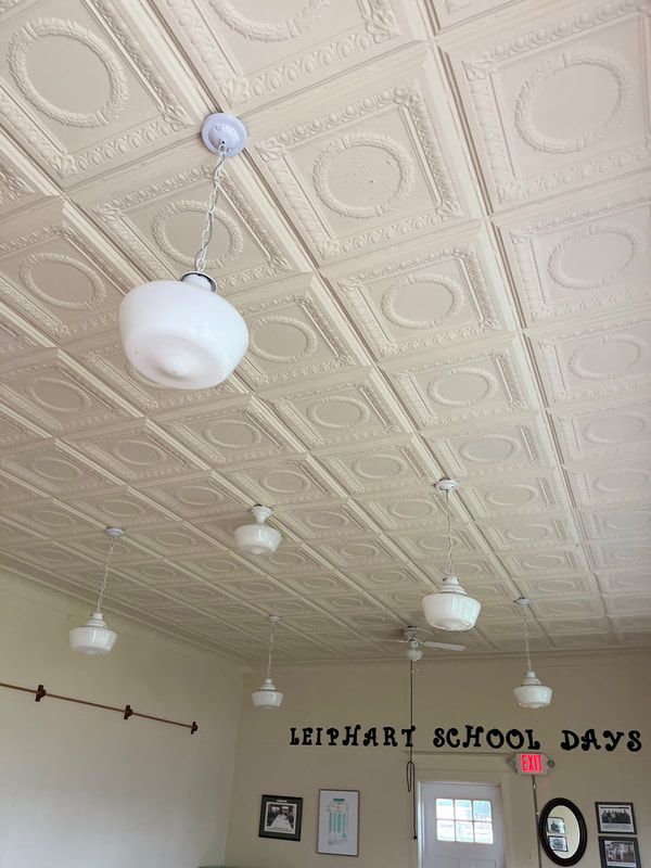 A picture of a ceiling with a sign that says leiphart school days