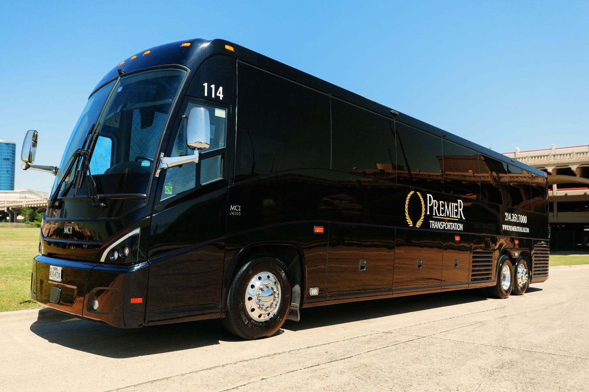 premier's black bus with the number 113 on it