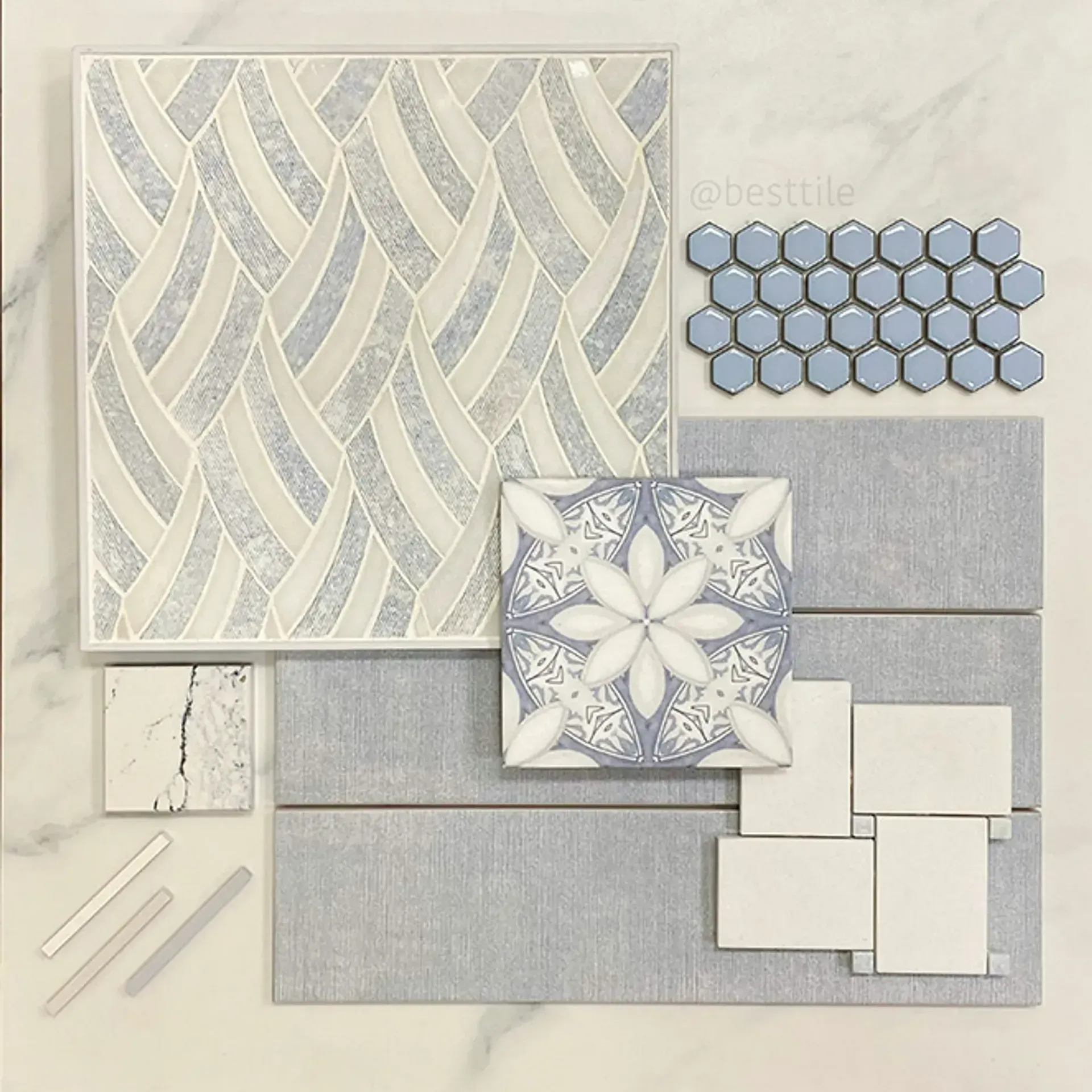 Neutral beige and blue tile and mosaic pattern samples arranged as a design board