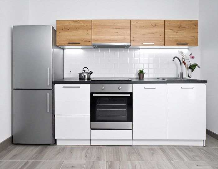 A kitchen with appliances, refrigerator, oven, sink and stove in Meridian, ID