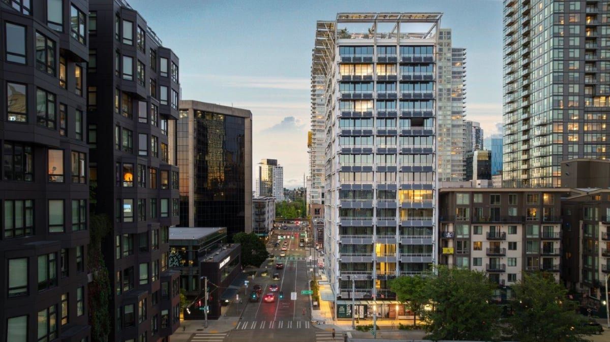 An aerial view of a city with tall buildings and a street.
