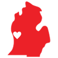 A red map of michigan with a white heart in the middle.