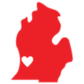 A red map of michigan with a white heart in the middle.