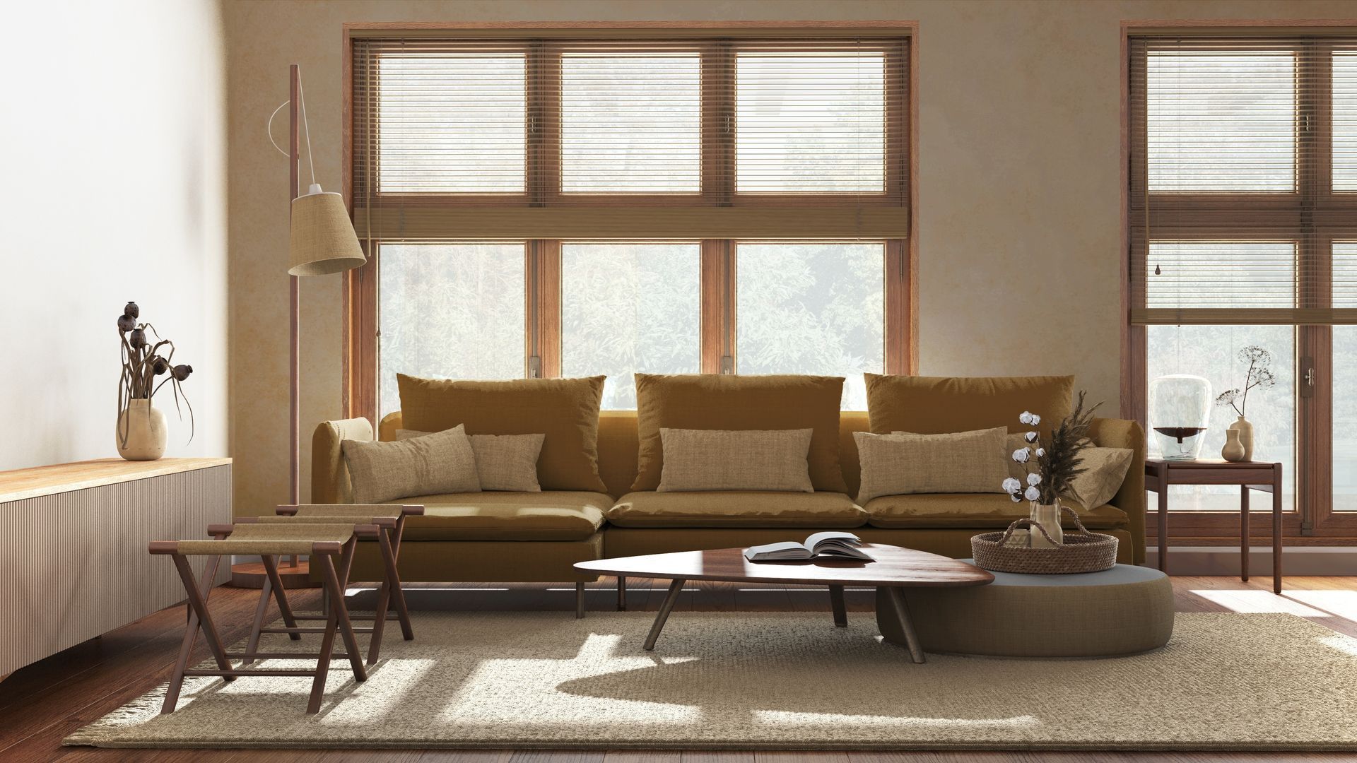 A living room with a couch , coffee table , chairs and lots of windows.