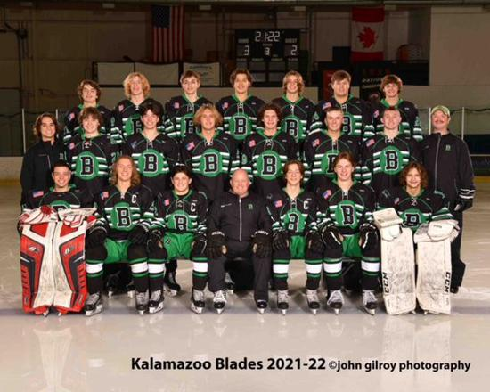 Kalamazoo Blades 2021–22 youth hockey team group photo in black and green uniforms on the rink