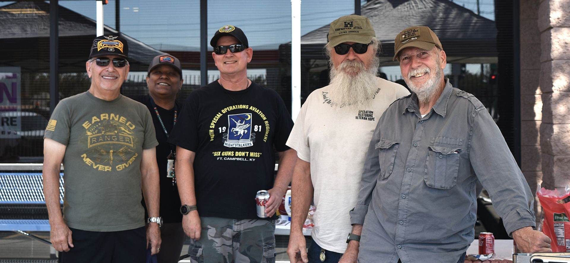 Local veterans spending time together at the shop during the free oil change appreciation event