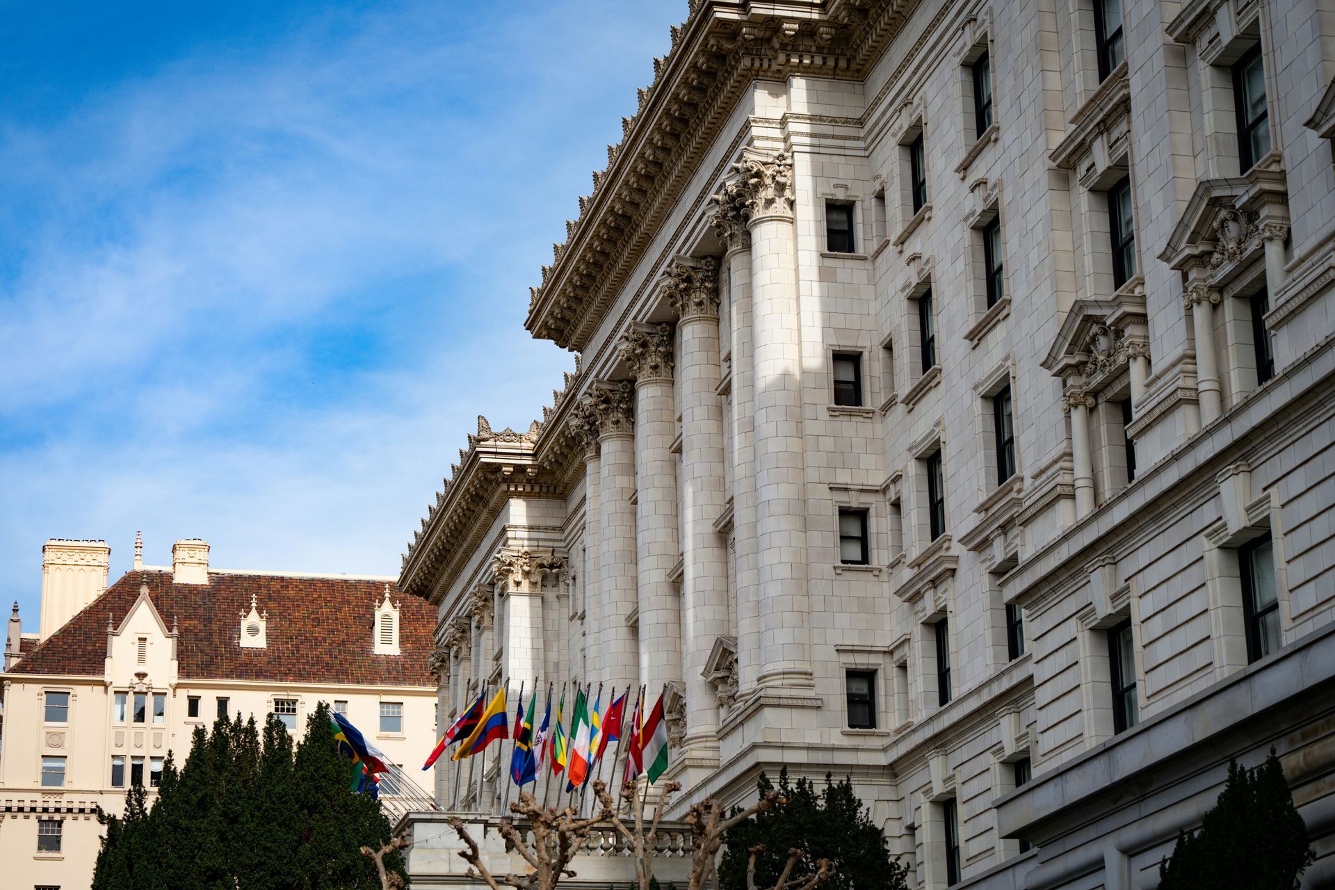 Grand embassy building with national flags, representing diplomatic moving London services for embassy families