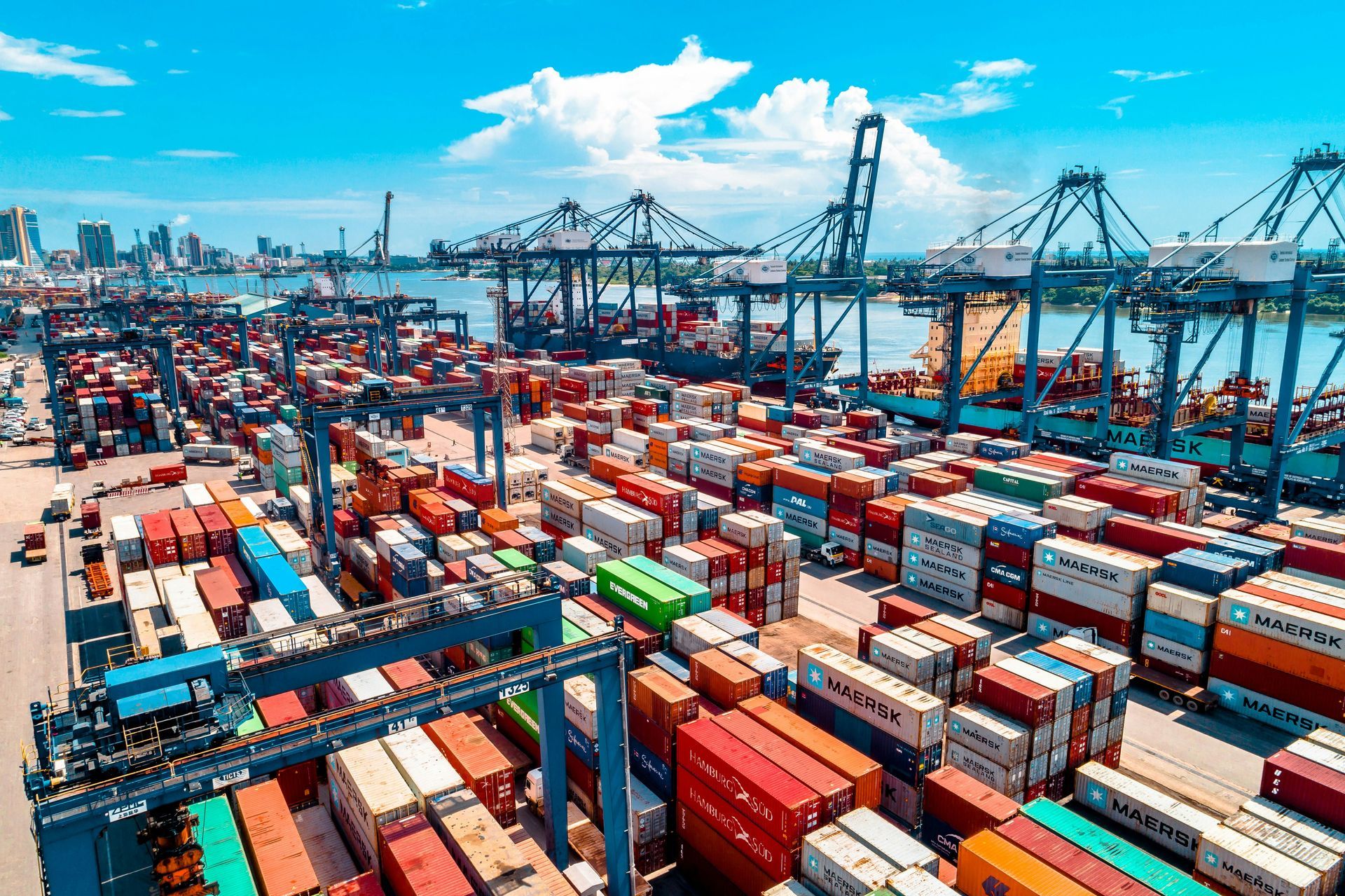 Diplomatic household goods shipping — international container port with Maersk shipping containers, The Mover Group London