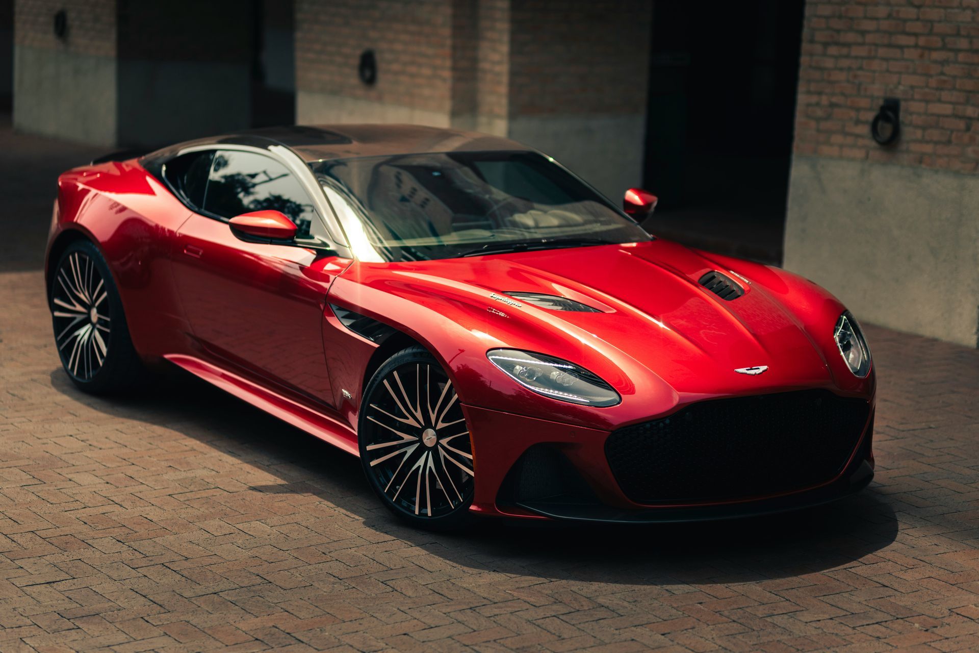 A red Aston Martin, the kind of car we ship from the UK to the USA in a sealed enclosed container.